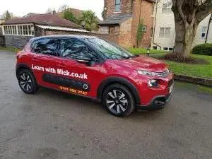 The red Peugot car